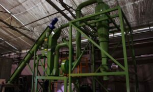 Indoor zig zag industrial air separator by Ghirarduzzi SRL, designed for efficient separation of materials like metals and plastics based on weight differences, installed in an industrial facility for recycling and material recovery